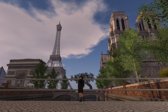 Attempt at a panoramic shot with myself standing in front of a canal with a bridge behind me. To the left, the Louvre Pyramid is barely visible behind the Arc de Triomphe. In the background stands the Eiffel Tower, and most of the right-hand side is taken up by Notre-Dame, partially hidden behind trees.