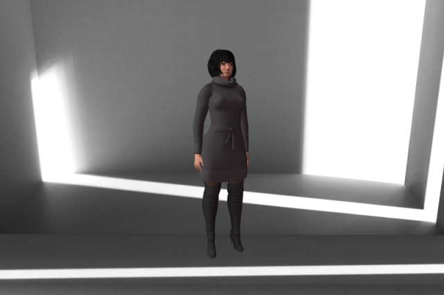 Me wearing a grey reMake Luella sweater dress and a pair of grey/black reBoot Luella Nova medium boots; the background is a grey box with various artificial highlights