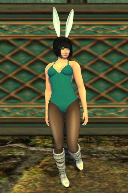 Me posing in the same outfit as on the previous pictures in this thread. The background shows part of the ArtSpeak Café, a wall in a similar tone of teal as my bathing-suit, decorated with a grid of diagonal golden lines with shading below them, giving the impression of being a relief while actually only being a texture.